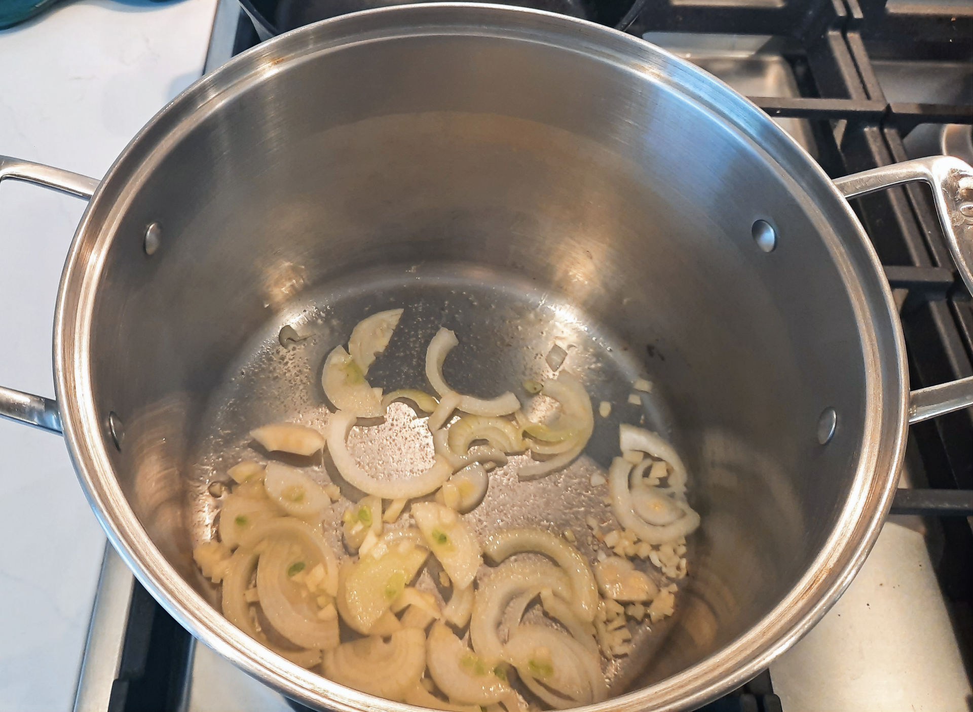 Saute onions and garlic for stuffed cabbage sauce