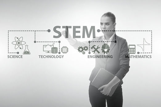 Businesswoman pressing virtual buttons in STEP education concept_edited.jpg