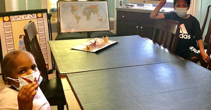 a child showing her paper crane