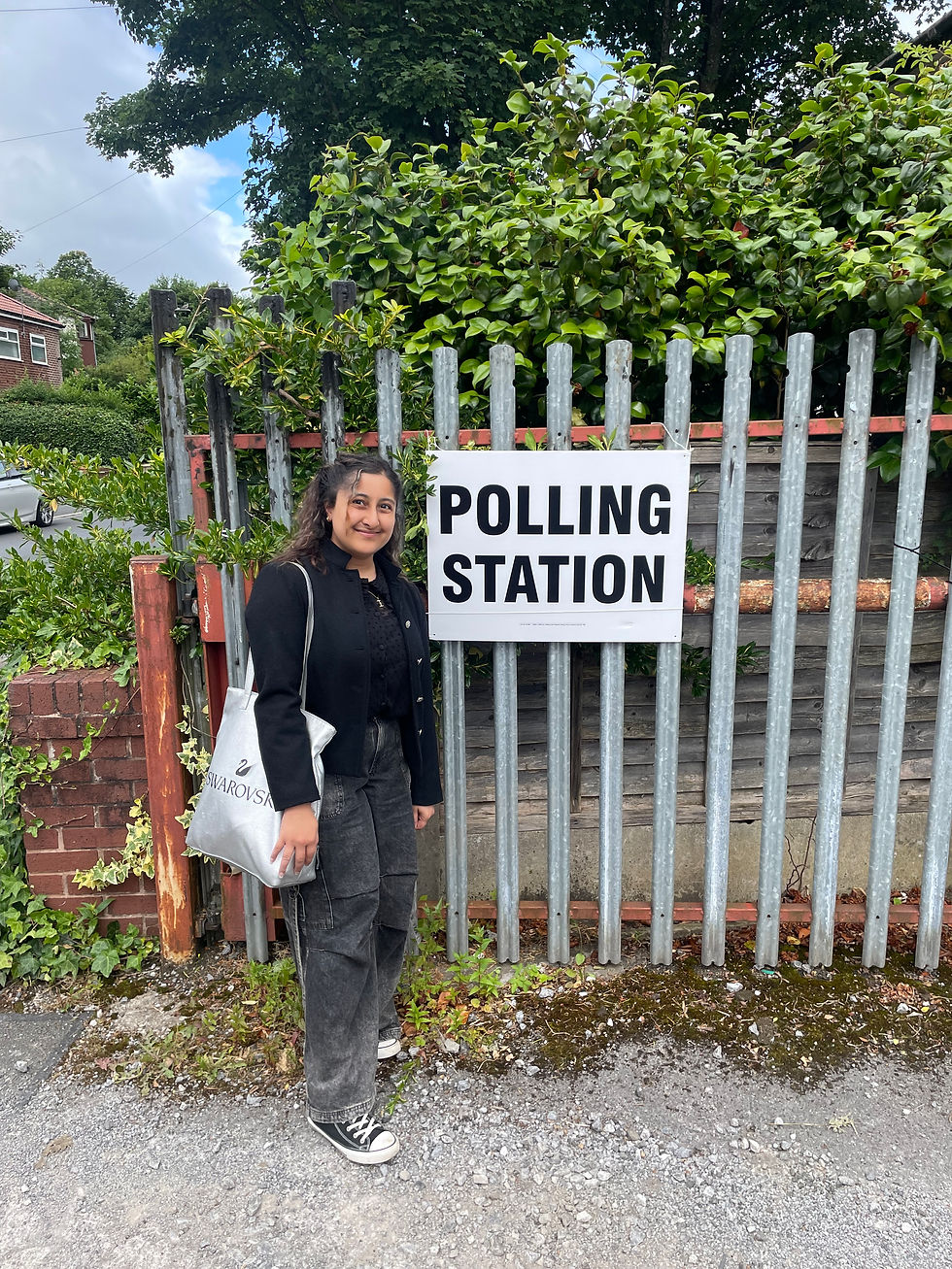 Author standing outside the polling station for her first national vote
