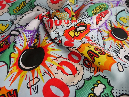 Boom, Pow, Bang Polyester Fabric on Sky Blue Background - Dressmaking Material 