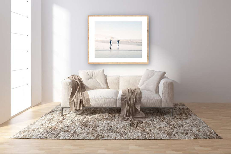 surf art print in wood frame hanging above sofa