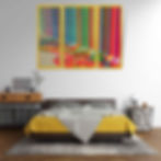 abstract triptych print displayed above bed