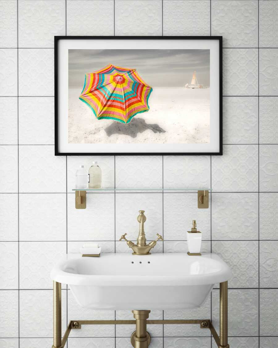 selective coloured beach print above wash basin in bathroom