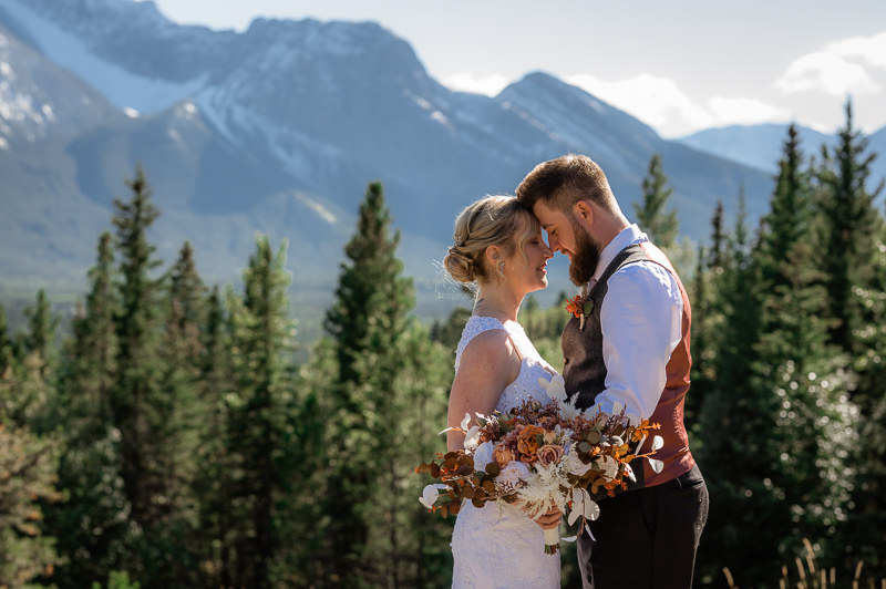 bride and groom in the rockies getting married 