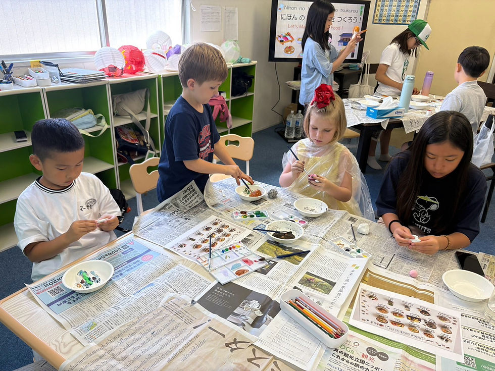 Children practising Japanese together in a small-group lesson at Elev8 kids camp in Tokyo