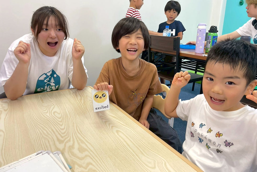 Koyuki teaching English to young learners in a small group classroom at Elev8 Tokyo, using interactive activities and real conversation practice