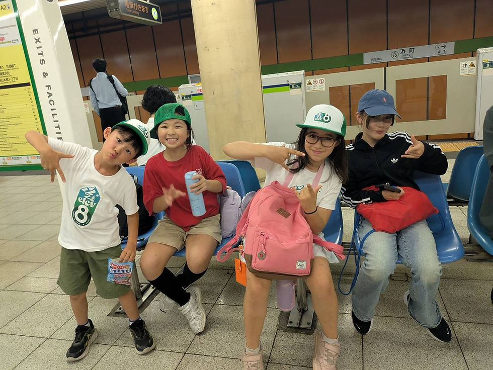 Children with Elev8 staff using the supervised chaperone service to travel safely to camp in Tokyo