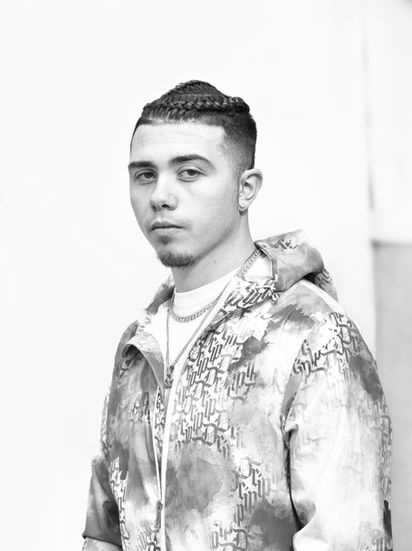 Young man in a hoodie posing for a portrait Erik van Cuyk Photography