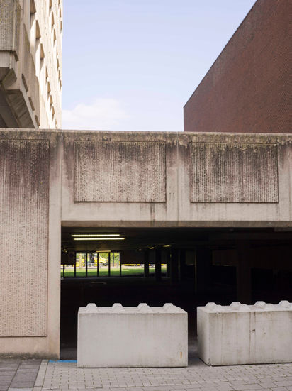 Concrete architecture with open space and a building, Erik van Cuyk Photography
