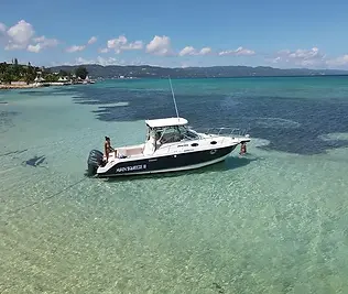 Accommodating up to 8 passengers, the Wellcraft Coastal boasts ample seating both on deck and in the cabin, ensuring that everyone can relax and enjoy the stunning views of the Caribbean Sea. The cabin features a full head (bathroom) and generous seating with a table, providing a comfortable and versatile space for socializing or taking a break from the sun.

With the Wellcraft Coastal, you can expect a seamless and unforgettable experience on the water, complete with modern amenities, ample space, and the opportunity to create lasting memories with friends and family. Whether you're a seasoned boater or a first-time adventurer, this boat charter offers an exceptional opportunity to explore the beauty of Montego Bay and its surrounding waters.

This cruise includes rum punch, bottled water, assorted sodas, pineapple juice & coconut rum.

It is recommended to bring sunblock, beach towels, & dry clothes.
