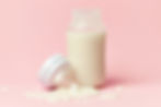 bottles with fresh breast milk on the counter
