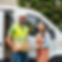A white delivery van. 1 man worker and 1 girl worker with smile..jpg