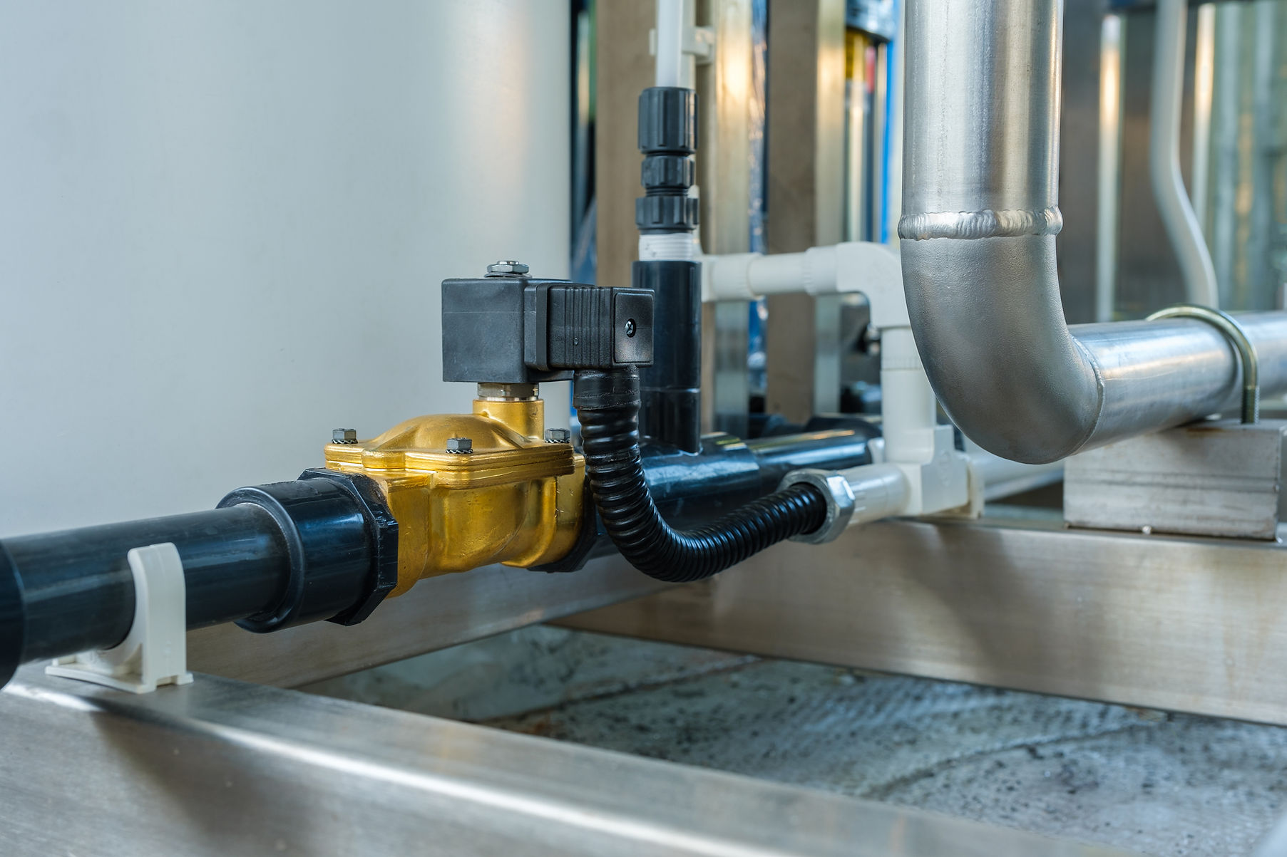 Close up solenoid valve controls the water supply that goes into the drinking water produc