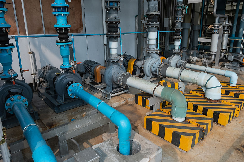 Row of industrial water pumping and water pipes.Waste water treatment plant..jpg
