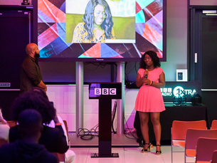 Lisa Maynard-Atem speaking at the BBC 1Xtra event after receiving an award for her work in social justice. She stands confidently at the podium, highlighting how personal branding rooted in value can lead to meaningful recognition.