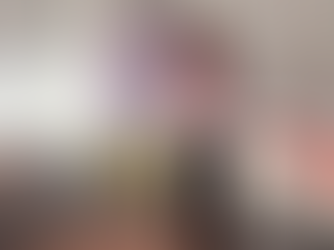 Farirai Gora stands smiling in a modern meeting space beside a We Are Eden banner. She is wearing a light pink blouse and tailored dark trousers, with her hands in her pockets. The banner behind her reads “We Are Eden – reproductive health support for all,” highlighting her work to normalise reproductive health conversations in the workplace.