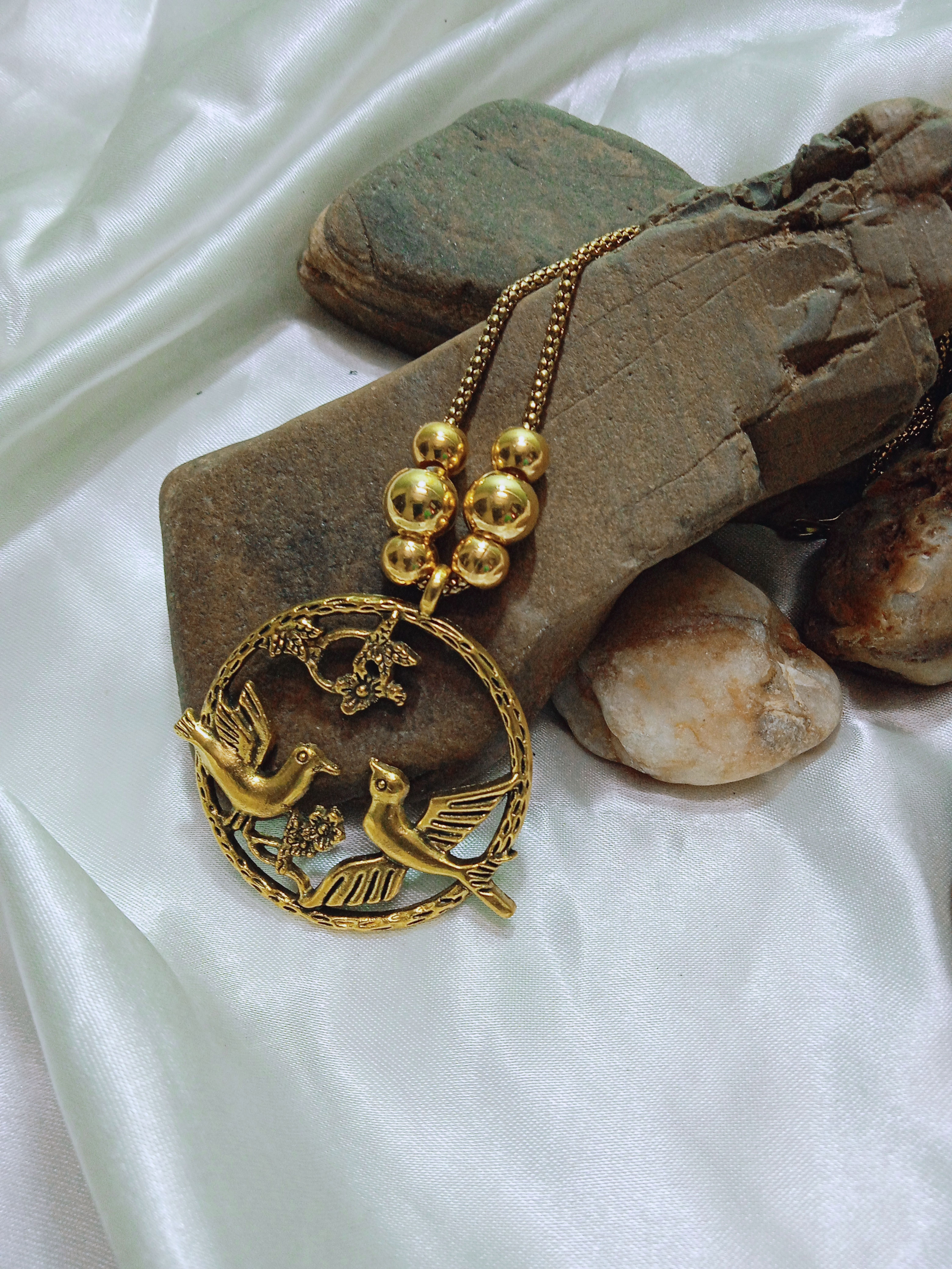 Okhali - Golden Oxidised Love Bird Pendant with snake chain