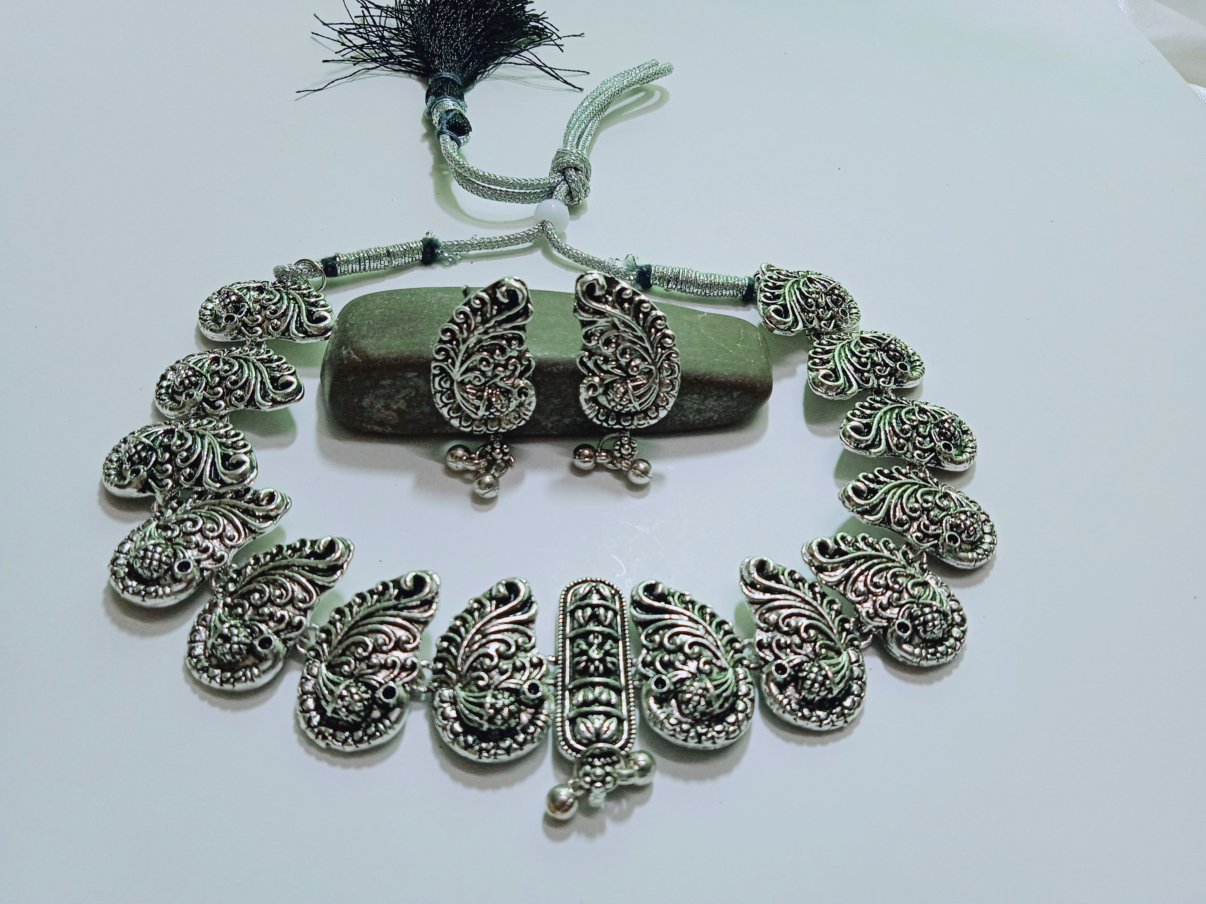 Okhali - German Silver Oxidised Antique Peacock Choker with Ghungroo
