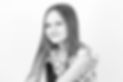 Black and white portrait image of a girl smiling during a studio session