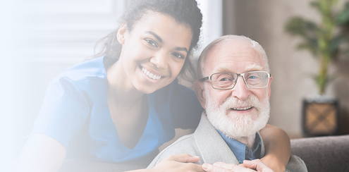 Nurse hugging an elderly patient in a supportive care setting, reflecting compassion, trust, and personalized memory care.