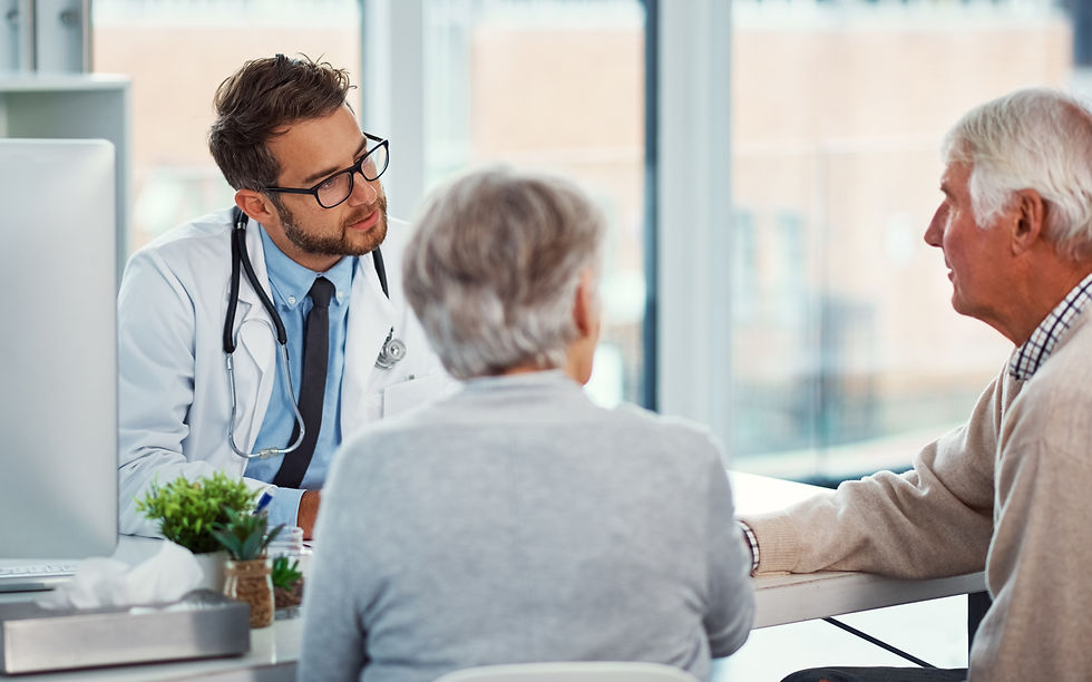 Doctor discussing a dementia diagnosis with an older couple and their family, representing education, assessment, and compassionate support for memory-related conditions.