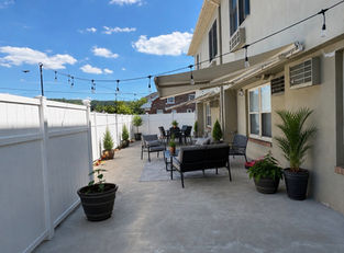 Outdoor patio seating area at PM Residence memory care community