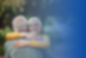 Elderly couple embrace.png