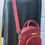 Thumbnail: Red bag with shoulder strap displayed on black dress AWESOMEROSE'S.