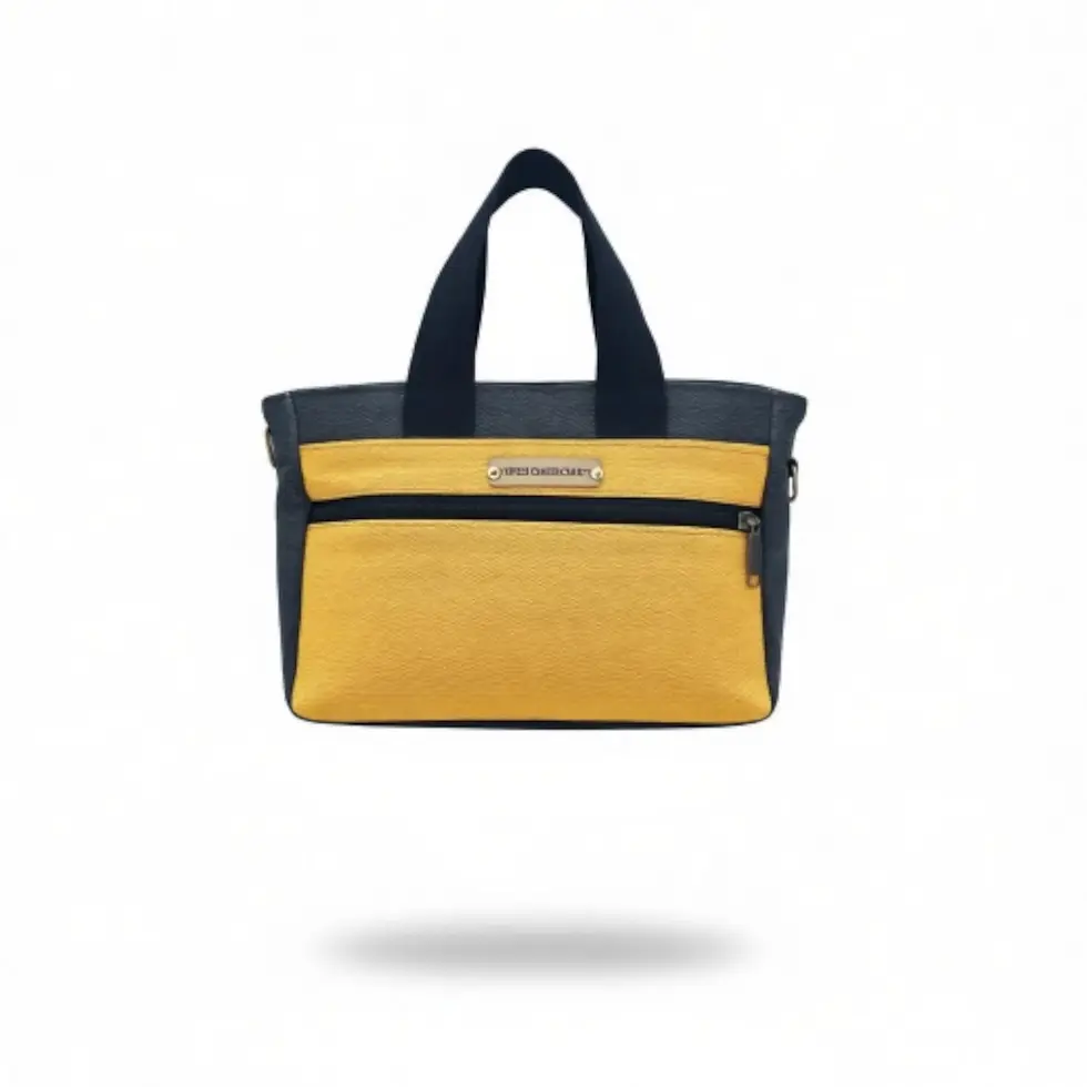 Yellow and navy 2-tone canvas tote bag with black handles on white background.