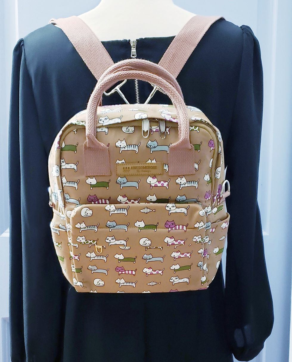 Thumbnail: Beige backpack with patterns and text, 2 way carrying, on black shirt. AWESOMEROSE'S