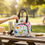 Thumbnail: Hand holding flamingo-patterned bag over a picnic table with a small canvas bag.