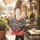 Thumbnail: Woman carrying a floral tote bag with a small cross-body adjustable strap bag AWESOMEROSE'S