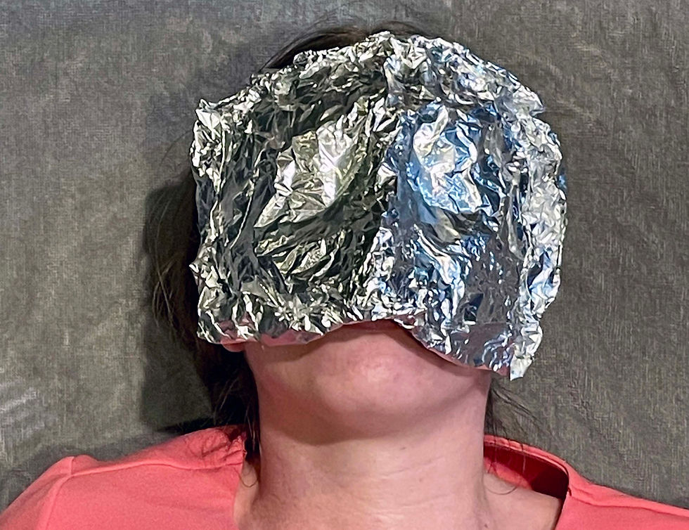image of a person with an aluminum foil mask over their face