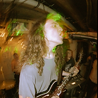 teacher ryan singing and playing guitar