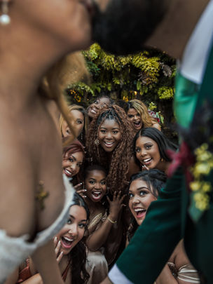 Bridesmaids cheer as bride and groom kiss, captured by Valentino Films