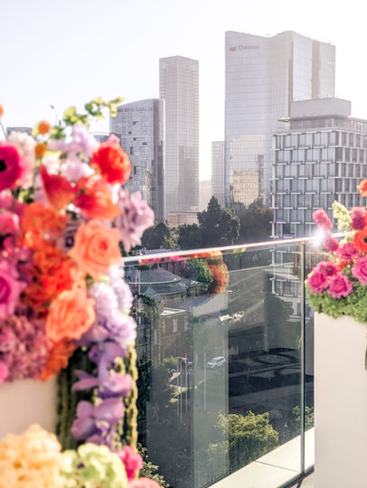 Vibrant flowers with a city skyline in the background