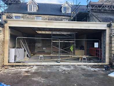 Cladding the front of a large steel beam.
