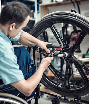 Technician repairing a wheelchair.jpg