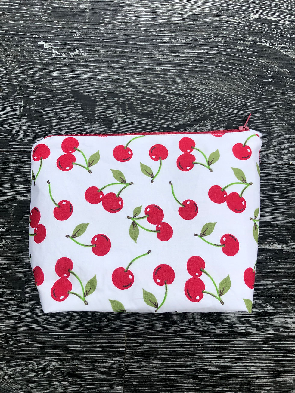 handmade make-up bag with red cherries and green stalks and matching red zip