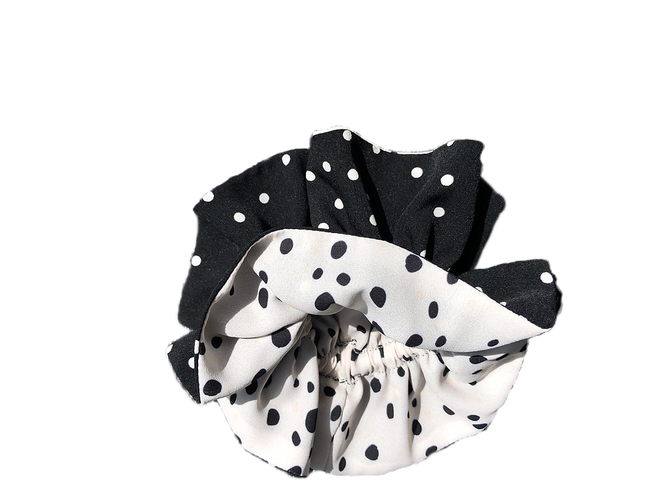 Reversible scrunchie with a mix of black and white spotted fabric