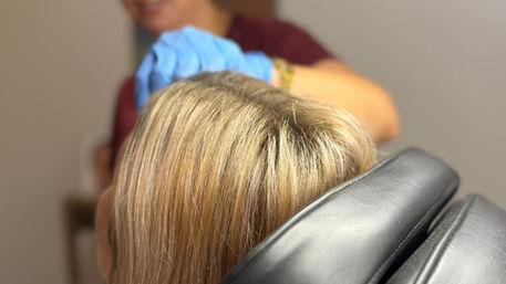 client receiving a professional skin treatment in a clinic in Nelson Tasman