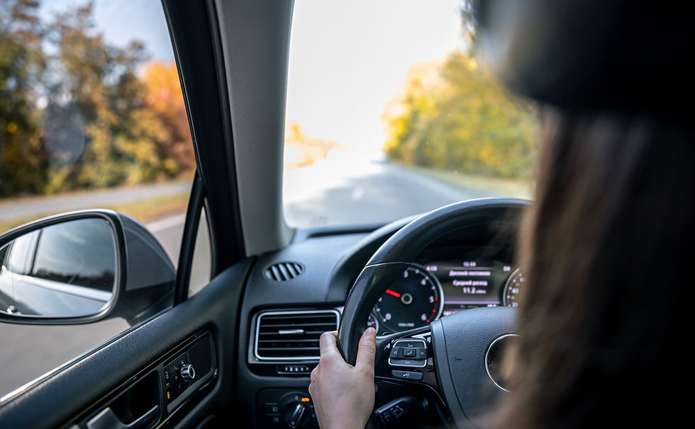 woman-drivers-hands-steering-wheel-inside-car.jpg