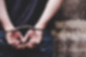 Thief under arrest and get cuffed by policeman Bad person stand against wall, get hand cro