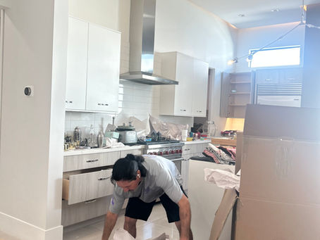 Professional movers unpacking  boxes into a new home in Phoenix, Arizona