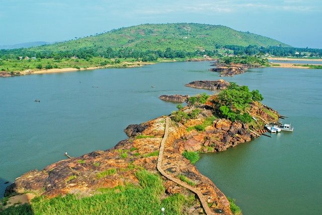 an image of a peninsula with lots of greenery and water