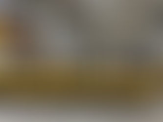 a row of forklifts in a factory setting.