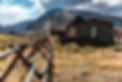 Old western house with moutains in the background in Cody, Wyoming_.jpg