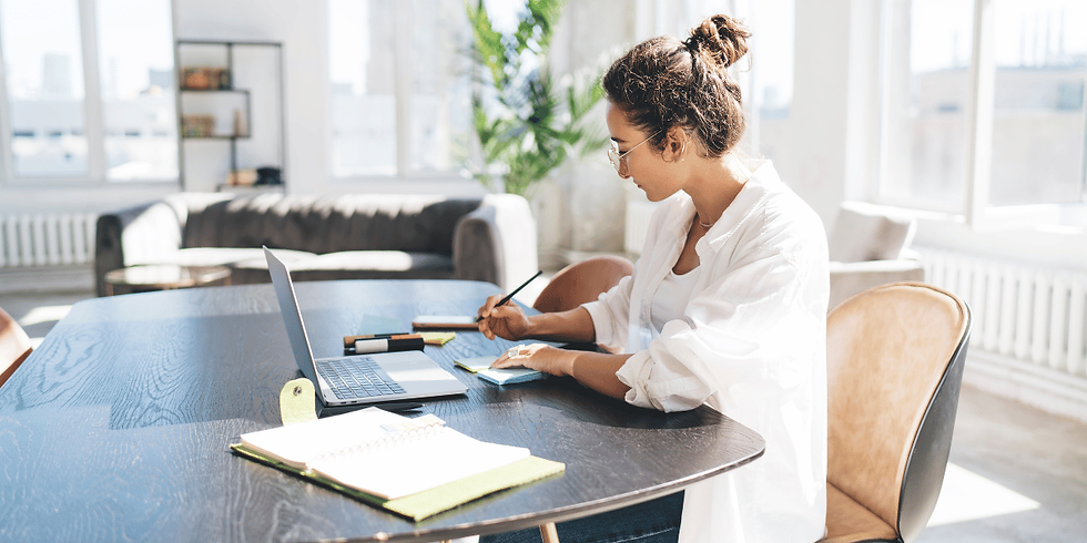 Woman working alone while reflecting on identity beyond success and productivity