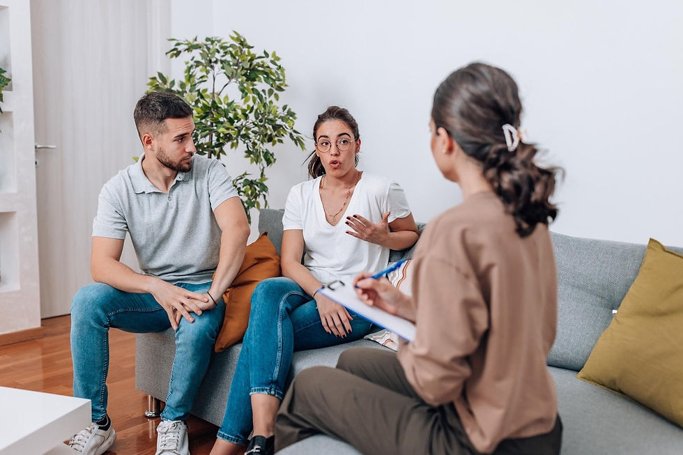 Couple discussing relationship concerns with a counsellor